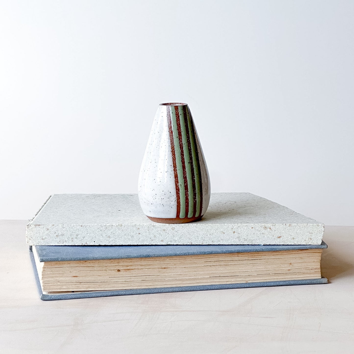 green and white mini vase with stripes