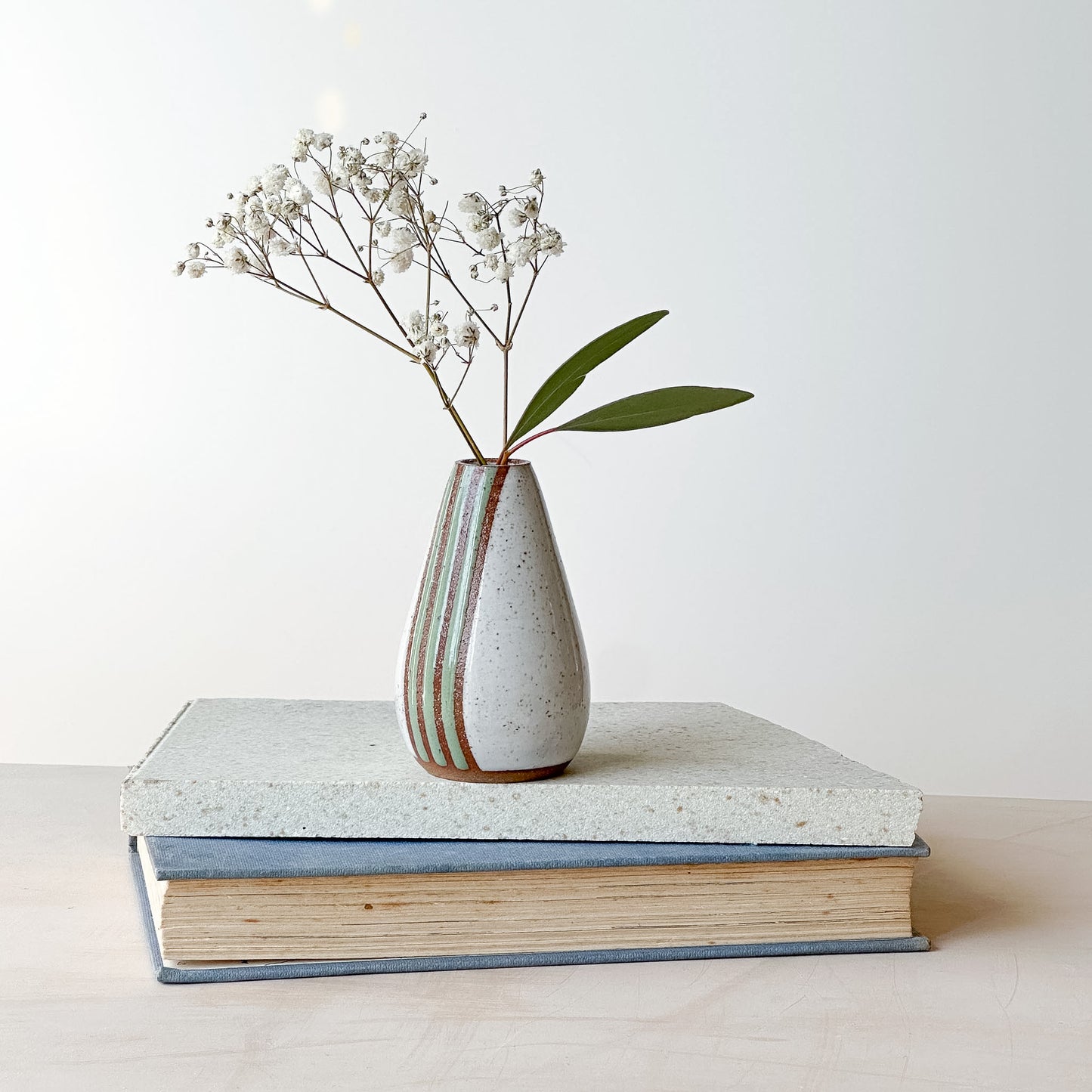 mini vase holding a small bouquet