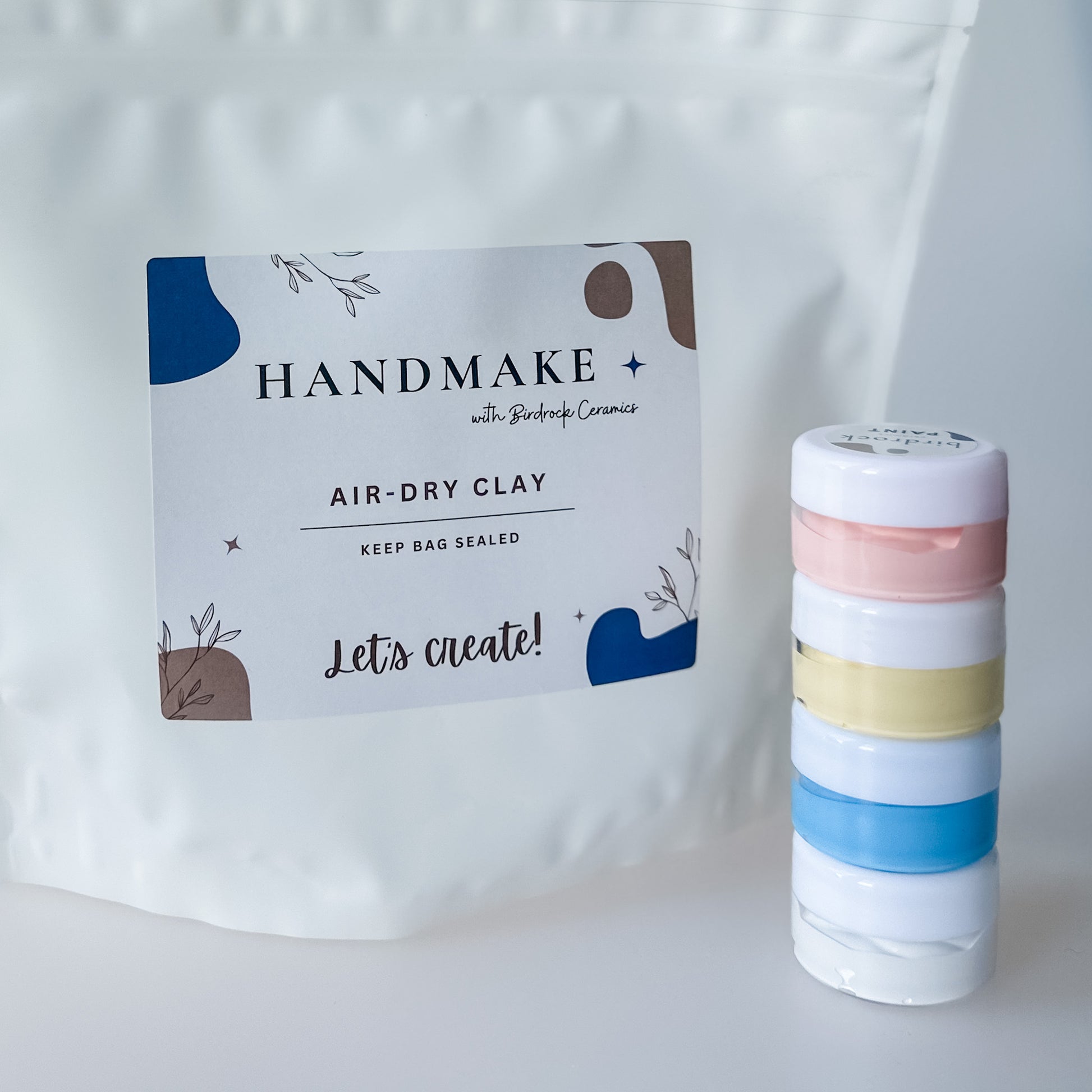 Handmake air-dry clay packaging with colorful clay paint on a white background