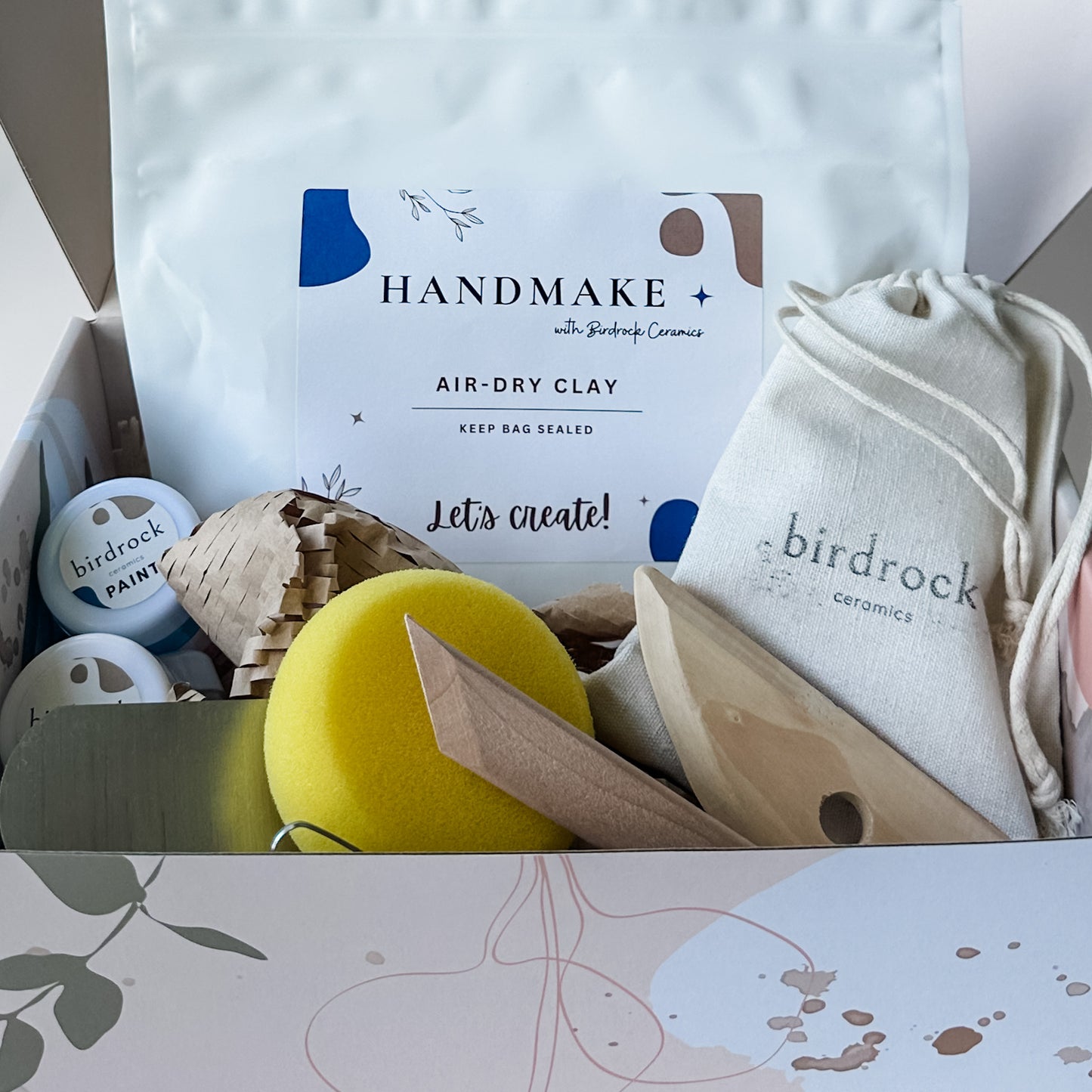 Birdrock Ceramics craft kit with air-dry clay, paint, and tools in a box.