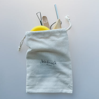 Birdrock Ceramics reusable utensil set in a drawstring bag on a light gray background